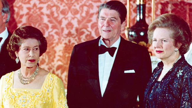 10/06/1984. Britain's Queen Elizabeth II, second left, stands with West German Chancellor Helmut Kohl, left, U.S. President Ronald Reagan, second right, and Britain's Prime Minister Margaret Thatcher at London's Buckingham Palace, prior to a dinner for summit leaders, in this file photo. The Queen will celebrate her 80th birthday on April 21, 2006. (AP Photo)