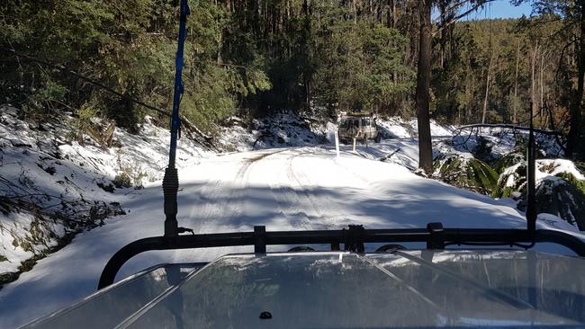 Rescuers feared the campers’ car slipped off one of the icy, slippery tracks.