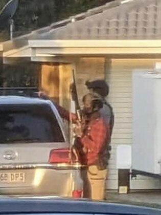 Armed police outside a Birkdale home on Wednesday.