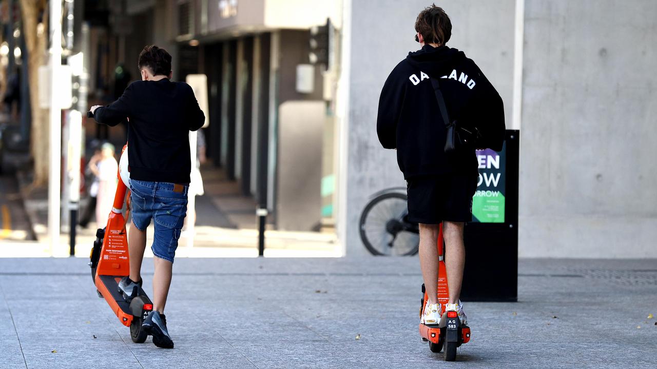 Young and helmetless e-scooter riders in Brisbane
