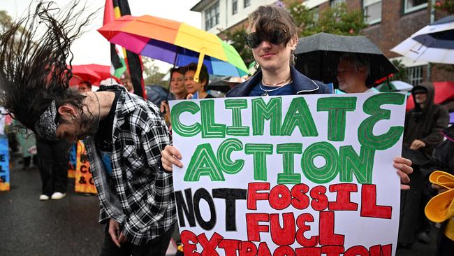 Environmental activists protest in front of Kirribilli House last year, calling for the Albanese government to halt further approvals of coal and gas projects. Picture: Saeed Khan/AFP