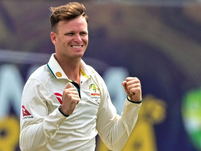 Matthew Kuhnemann celebrates after taking one of his nine wickets. Picture: AFP