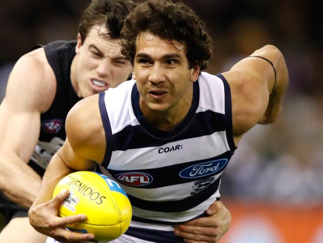 MELBOURNE, AUSTRALIA - JULY 29: Nakia Cockatoo of the Cats is tackled by Lachie Plowman of the Blues during the 2017 AFL round 19 match between the Carlton Blues and the Geelong Cats at Etihad Stadium on July 29, 2017 in Melbourne, Australia. (Photo by Michael Willson/AFL Media/Getty Images)