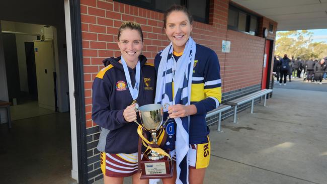 Sam Coppinger and Tayissa Coppinger with the A-Grade premiership cup and flag.