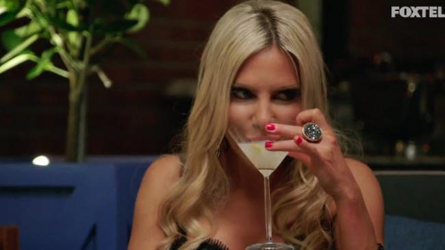 As in any confrontation, Melissa focuses her attentions on quietly drinking in the corner