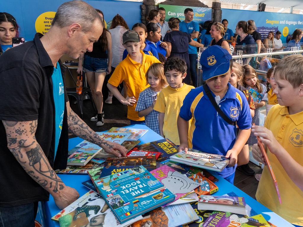 Decisions, decisions: the first swap of this year’s Great Book Swap got underway in Sydney with a little help from beloved Aussie author Andy Griffiths. Picture: Joseph Mayers/ILF/supplied