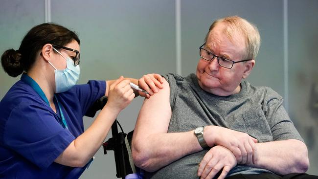 Svein Andersen, a 67 year-old resident of Ellingsrud home was the first in Norway to receive the Pfizer-Biontech COVID-19 vaccine by nurse Maria Golding in Oslo, Norway, on December 27. Picture: AFP