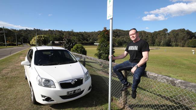 Nick Flanagan at Pioneer Downs Park with the new parking signs. Picture Glenn Hampson