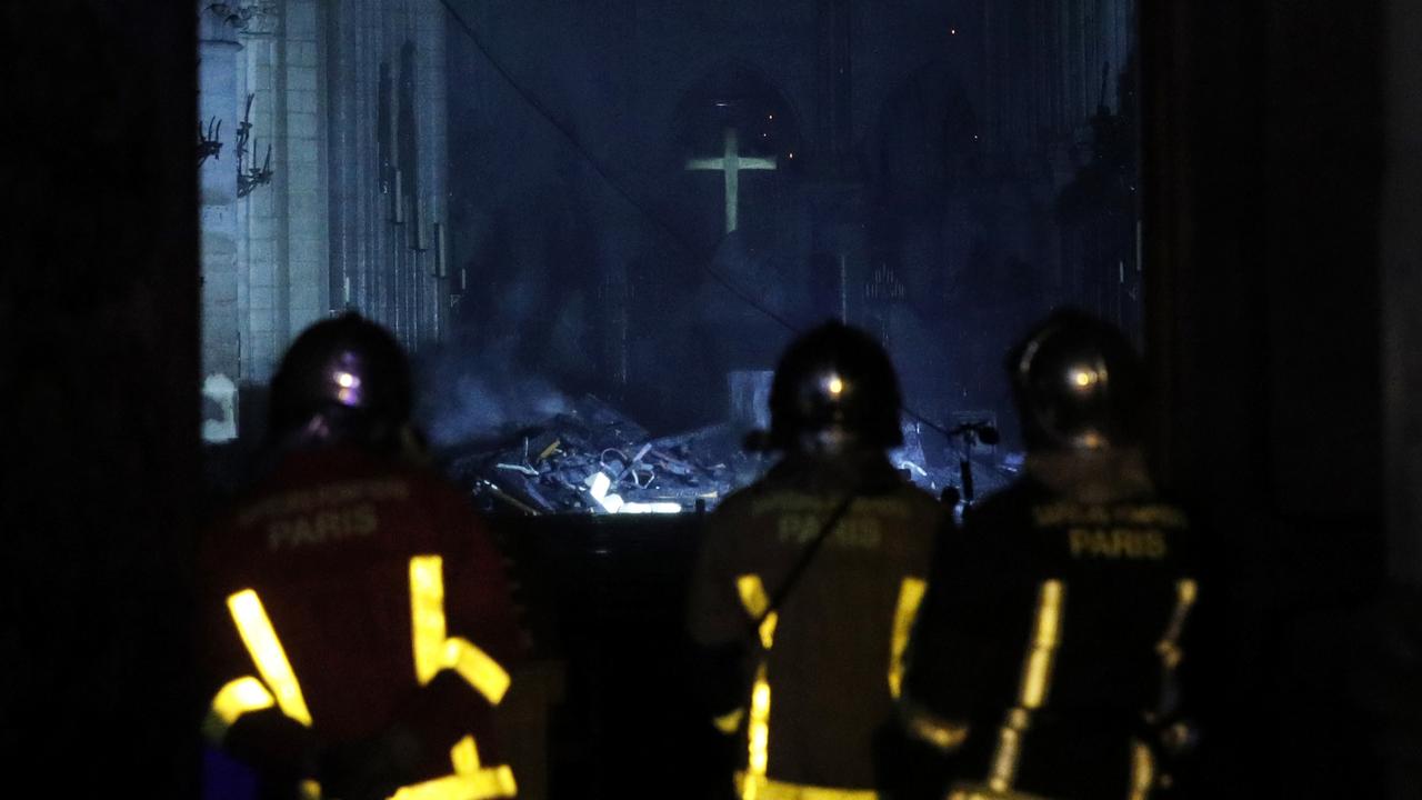 French firemen enter the Notre-Dame Cathedral as flames are burning on the roof cathedral in Paris. Picture: EPA/YOAN VALA.