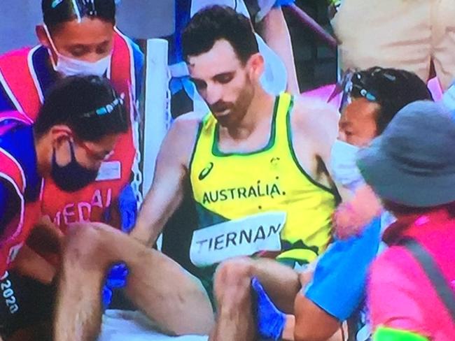 Patrick Tiernan was wheeled from the track after collapsing.