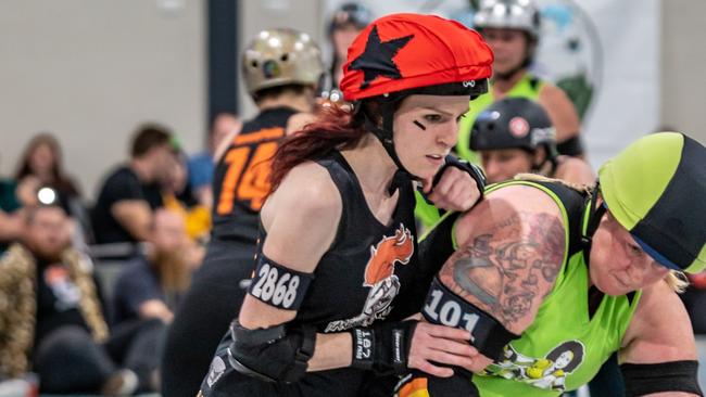 The aim is for the jammer (with a star on their helmet) to overlap the opposition blockers. Photo: Mark Zouroudis.