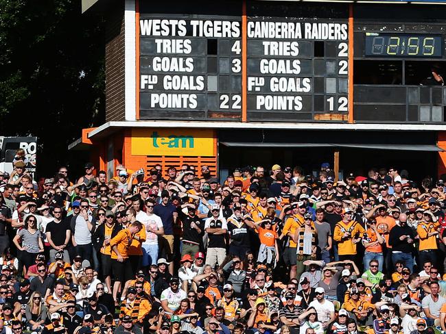 A large crowd watches on during the Wests Tigers v Canberra Raiders rugby league game at Leichhardt Oval, Sydney. Pic Brett Costello