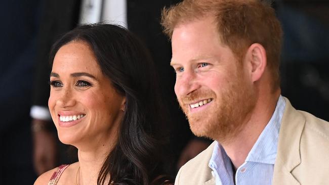 Britain's Prince Harry (R), Duke of Sussex, and his wife Meghan Markle are pictured during a visit to the National Centre for the Arts in Bogota on August 15, 2024. Prince Harry and his wife, American actress Meghan Markle, arrived in Colombia at the invitation of Marquez, with whom they will attend various meetings with women and young people to reject discrimination and cyberbullying. (Photo by RAUL ARBOLEDA / AFP)