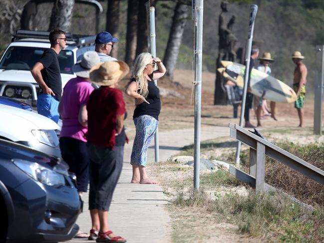 Onlookers watch as emergency services conduct a search for the friends. Picture: Nathan Edwards