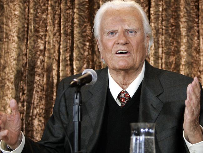 Evangelist Billy Graham takes questions at a press conference in 2005. Picture: AFP