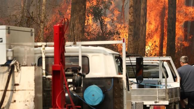 Two massive blazes ravaging northern NSW have joined. Picture: AAP