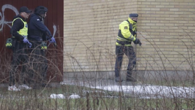 Police at the school in Obrero. Picture: BBC.