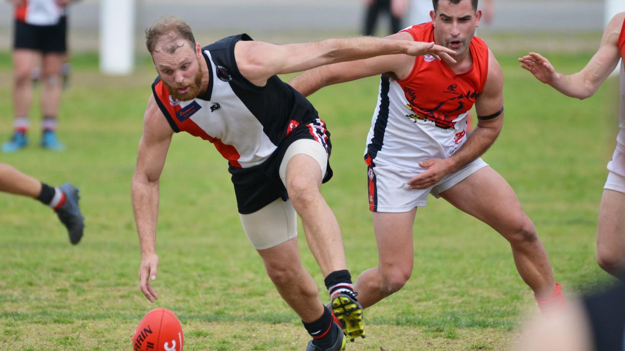 Southern Football League match between Christies Beach and Flagstaff Hill at Christies Beach, Saturday, August 17, 2019. Jacob Crate from Christies Beach attacks the ball. (Pic: AAP/Brenton Edwards)