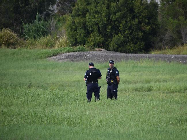 Police in a vacant area off the Bruce Highway at Paget about 100m from The Park caravan park where a 25-year-old man's body was allegdly found about 3am on Tuesday, December 14, 2021. Picture: Matthew Forrest