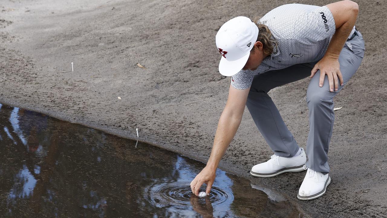 NCA. MELBOURNE, AUSTRALIA. 28th November 2024. Australian Open golf at Victoria Golf Club. Day 1. Cam Smith gets a free drop out of the water in the bunker at the 2nd hole . Picture: Michael Klein