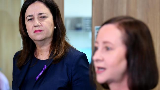 BRISBANE, AUSTRALIA - NewsWire Photos - MARCH 08, 2021. Queensland Premier Annastacia Palaszczuk watches Health Minister Yvette D'Ath as she speaks during a visit to the Surgical, Treatment and Rehabilitation Service (STARS) facility. Picture: NCA NewsWire / Dan Peled