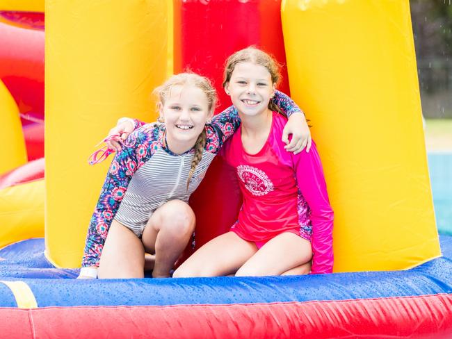 An inflatable obstacle course will be used at the Norwood Pool, almost four years after the council removed its popular diving board. Left: Kelsey Wundke, Right: Ella Koch. Picture: Dan Schultz (Supplied by The City of Norwood Payneham & St Peters Council.)