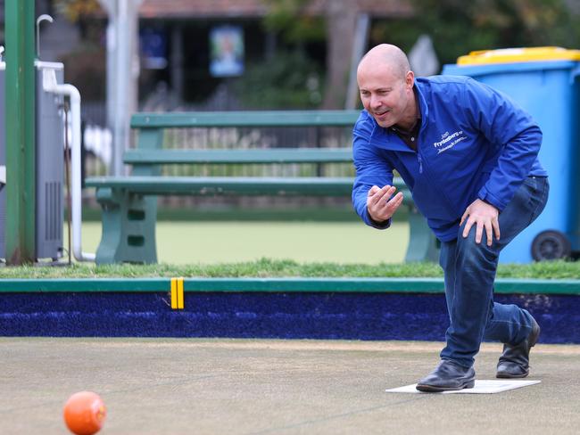 Josh Frydenberg plays lawn bowls while campaigning at Hawthorn Bowls Club. Picture: Brendan Beckett