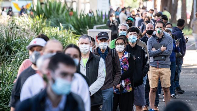 People queue at the NSW Vaccination Centre in Homebush, Sydney. Picture: NCA NewsWire / James Gourley