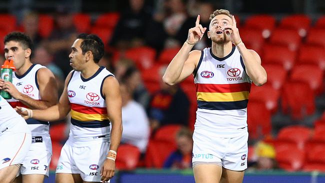 Hugh Greenwood looks towards the sky in memory of his late mother after kicking a goal against Gold Coast. Picture: Jono Searle (Getty).