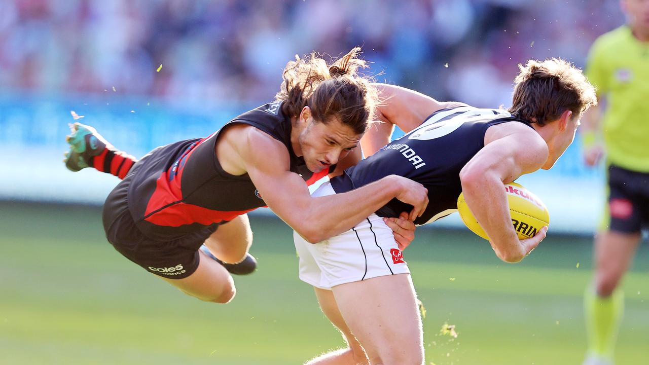 Sam Walsh attempts to dodge a tackle from Archie Perkins. Picture: Michael Klein