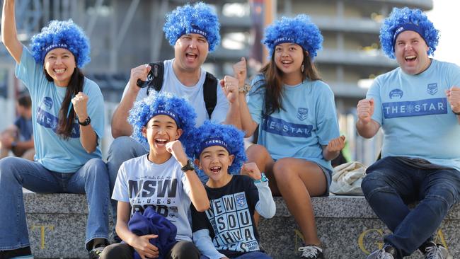 Michelle and Howard Newby with their children Joshua (11), Caleb (7), Katelyn (14) and Tim Westman (R) at ANZ Stadium. Picture: Christian Gilles