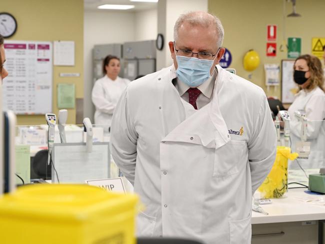 The Prime Minister Scott Morrison toured the Astra Zeneca laboratories in Macquarie Park. The government has signed an agreement with them to produce the Oxford University Coronavirus vaccine if it is successful. Local member John Alexander , Professor Paul Kelly. Photo Nick Moir 19 August 2020