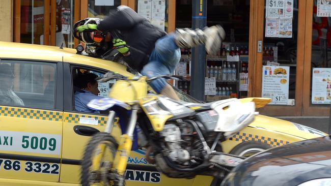 Sometimes photographers are just in the right place at the right time (or wrong time) to capture incredible images. That was the case with this amazing photo by Jason Sammon taken in 2013, of a man on a motorbike crashing into, and being flung over, a taxi on Station St Frankston, after attempting to avoid police wishing to pull him over. He later walked to an awaiting ambulance.