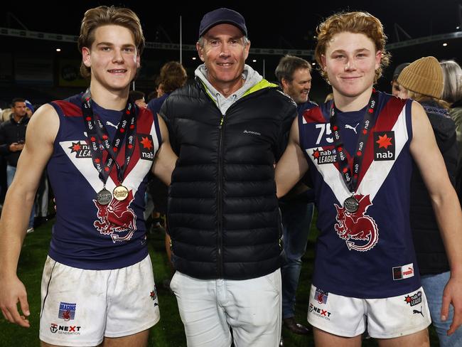 Will Ashcroft (left) and Levi Ashcroft (right) played in a 2022 premiership together for the Sandringham Dragons. Their father Marcus (centre) was a three-time Brisbane Lions premiership player. Picture: Getty Images