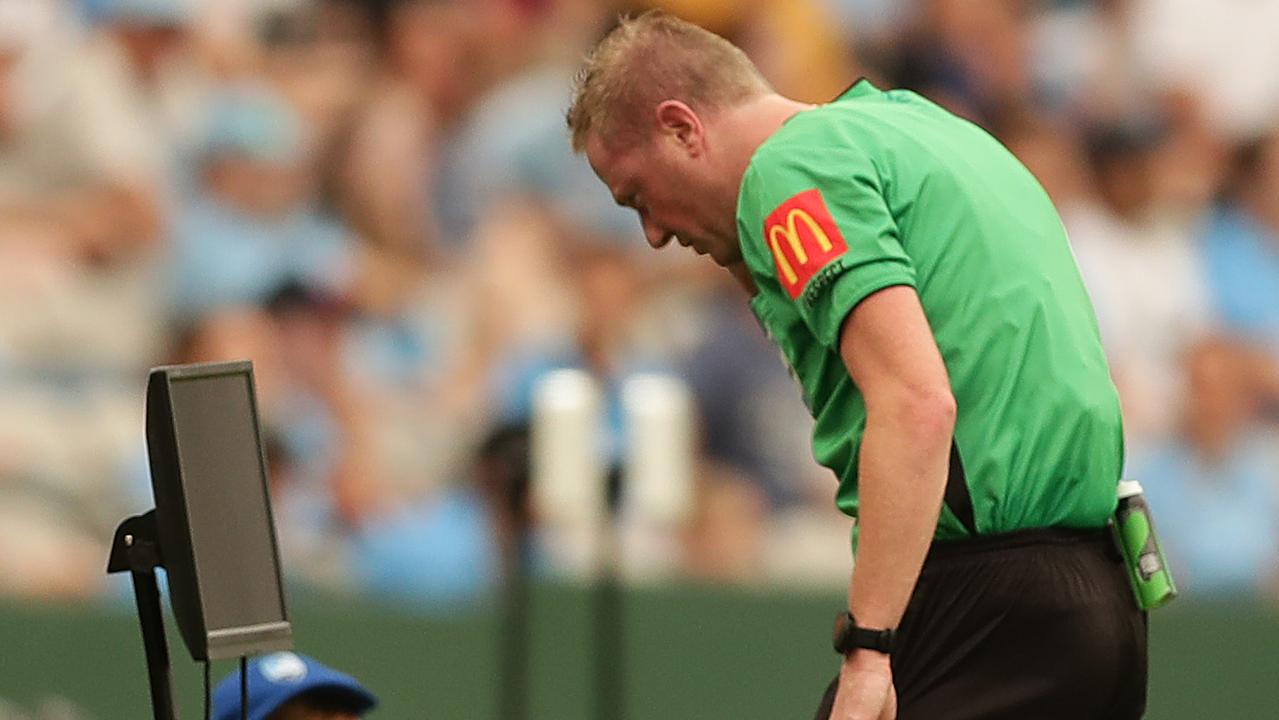 The referee consults VAR before deciding to give Rhyan Grant of Sydney FC a red card against Melbourne City.