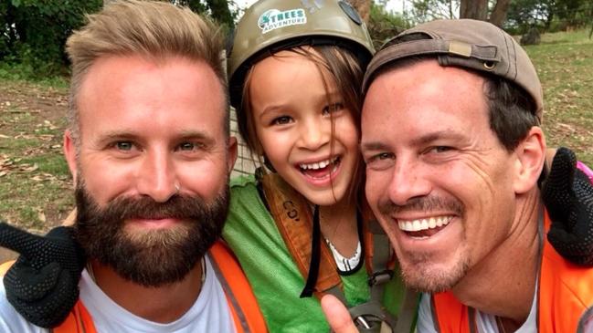 Falls Creek's Colin Tuohy with his daughter Maple and partner Michael Boyd.