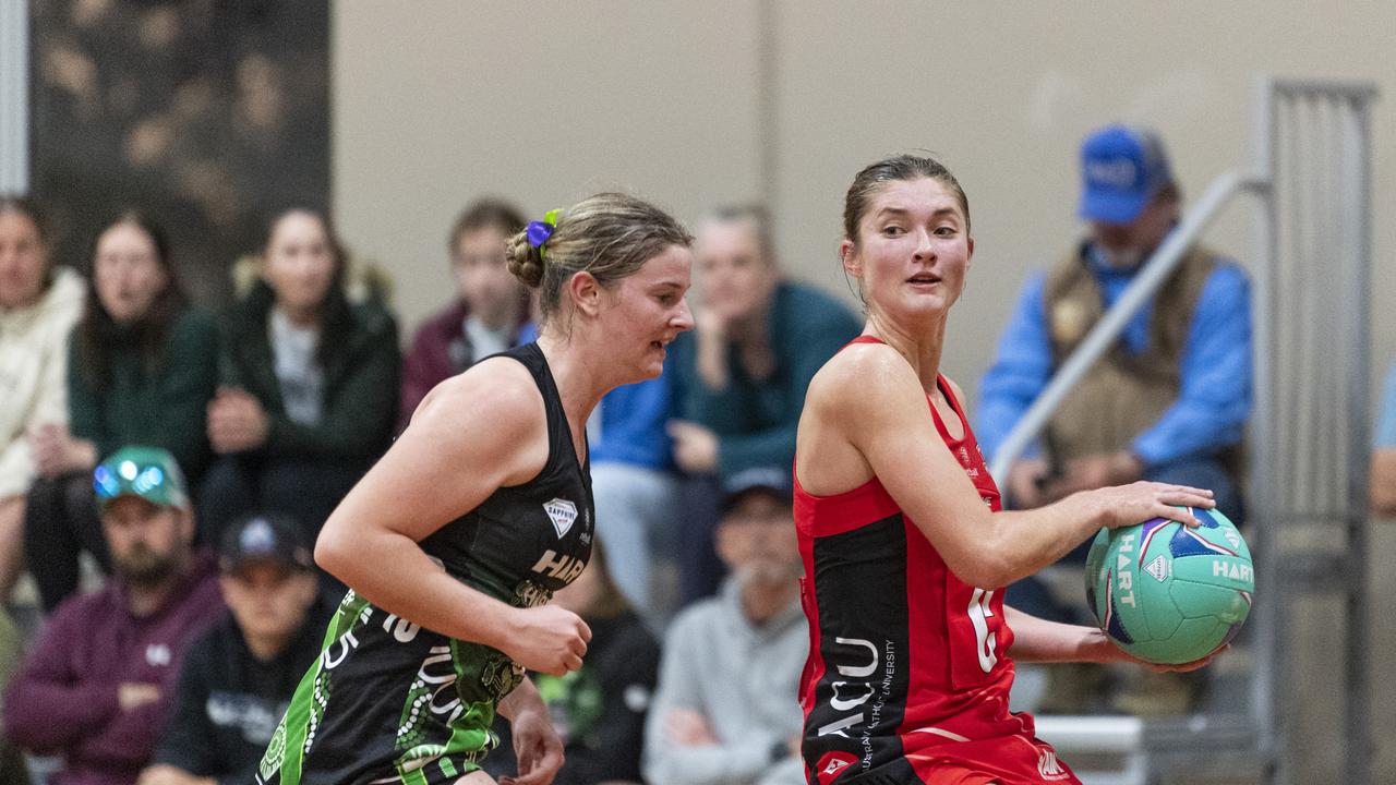 Ella Norton (left) of Darling Downs Panthers defends against Georgina Roy of ACU Brisbane North Cougars.