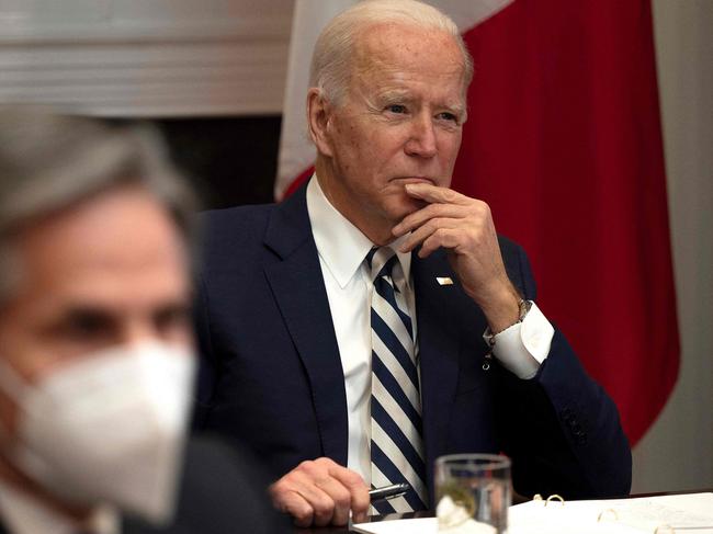 US President Joe Biden, flanked by US Secretary of State Antony Blinken (L), meets virtually with Mexican President Andres Manuel Lopez Obrador at the White House in Washington, DC, on March 1, 2021. (Photo by JIM WATSON / AFP)