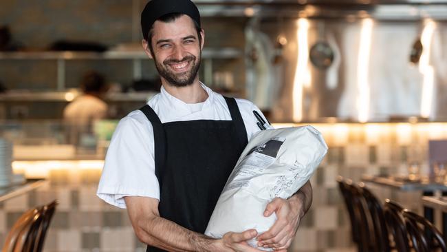 Italian Street Kitchen head chef Enrico Marchese with the flour. Picture: Monique Harmer