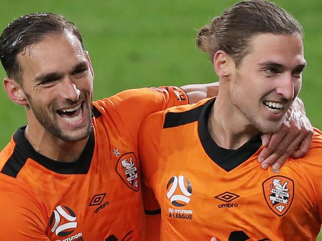 SYDNEY, AUSTRALIA - JULY 29: Matthew Ridenton of the Roar (R) celebrates with Jack Hingert (L) after scoring a goal during the round 24 A-League match between the Melbourne Victory and the Brisbane Roar at Bankwest Stadium on July 29, 2020 in Sydney, Australia. (Photo by Matt King/Getty Images)