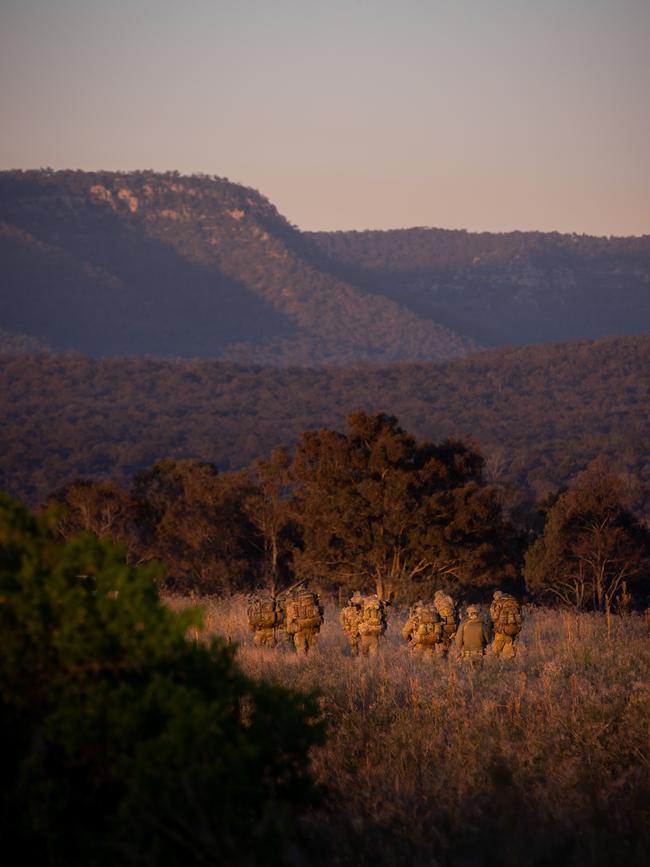 Australian army soldiers from the 3rd Battalion, Royal Australian Regiment, conduct a section patrol during the 2022 Duke of Gloucester Cup in Singleton. *** Local Caption *** Australian Army infantry soldiers from across Australia tested their core skills for the prestigious Duke of Gloucester Cup at the School of Infantry, near Singleton in NSW, July 31 - August 5 2022. The Duke of Gloucester Cup is the Armyâ€™s premier military skills competition, pitting the best Royal Australian Corps of Infantry rifle sections from each unit against one another through a series of challenging activities that test their core infantry skills, including marksmanship, tactics, teamwork and fitness. Along with the Duke of Gloucester Cup, five other trophies are awarded: Sir Arthur MacDonald Trophy for best foundation war-fighting skills; Gurkha Trophy for best live-fire shooting; Royal Ulster Rifles Trophy for best falling plate shooting; OSCMAR Trophy for best battle endurance; and the DSM Roche CSC Memorial Cup for best individual soldier. The Duke of Gloucester Cup was created by Prince Henry, Duke of Gloucester, in 1946, while serving as the Governor-General of Australia.