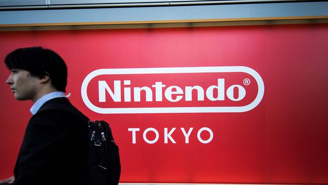 A man walking past a logo of Japan's Nintendo Co. displayed at a store in Tokyo. Picture: AFP