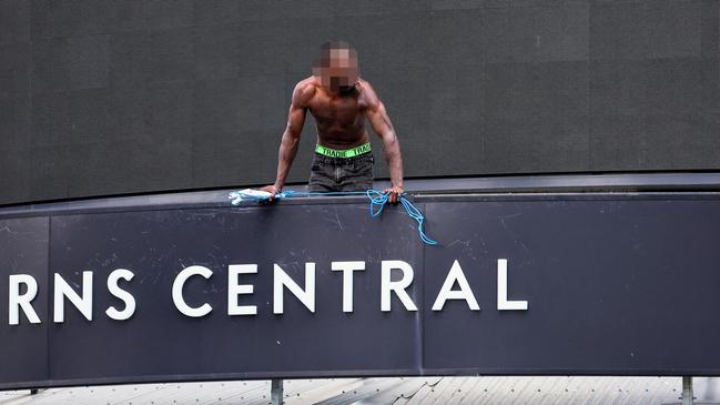 A man was seen scaling the Cairns Central shopping centre on Monday morning, allegedly ripping cables and lighting out from the ceiling. Picture: Brendan Radke