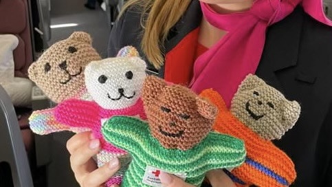 Teddies from Red Cross handed out to children on the Qantas repatriation flight, bringing Australians home from Israel. Picture: Supplied