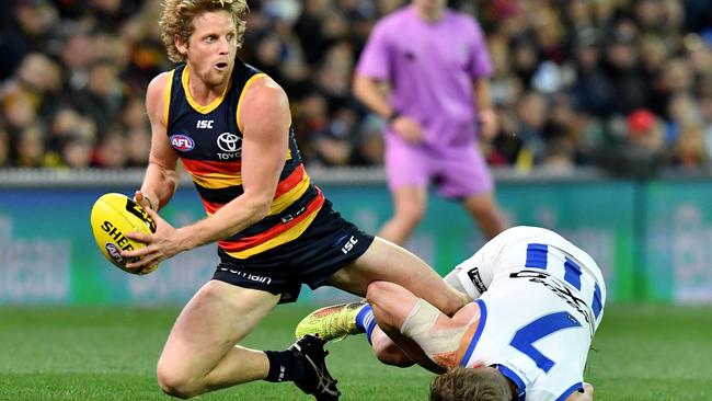 Rory Sloane tries to escape Jack Ziebell’s clutches. Picture: AAP Image/Kelly Barnes