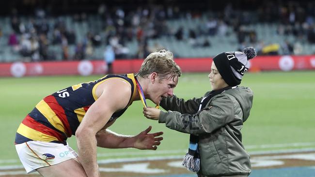 Alex Keath receives the Showdown Medal for his efforts in Round 8. Picture SARAH REED