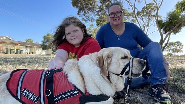 Murrianna Reese and her son Logan with his assistance dog Hunter. Picture: Dylan Hogarth