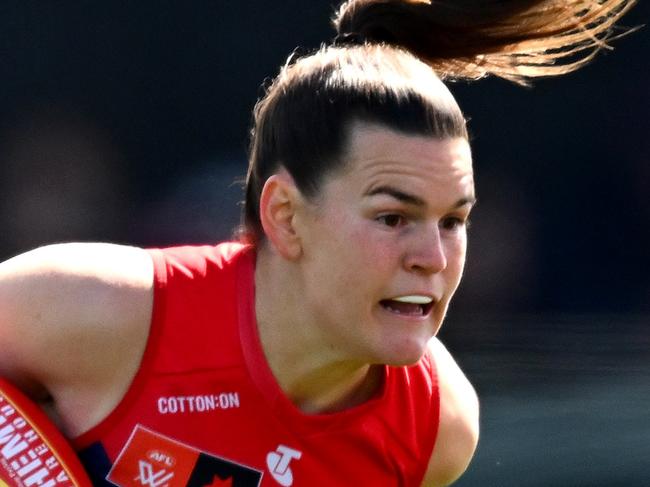 MELBOURNE, AUSTRALIA - SEPTEMBER 15: Lily Mithen of the Demons is tackled during the round three AFLW match between Melbourne Demons and North Melbourne Kangaroos at Casey Fields, on September 15, 2024, in Melbourne, Australia. (Photo by Quinn Rooney/Getty Images)