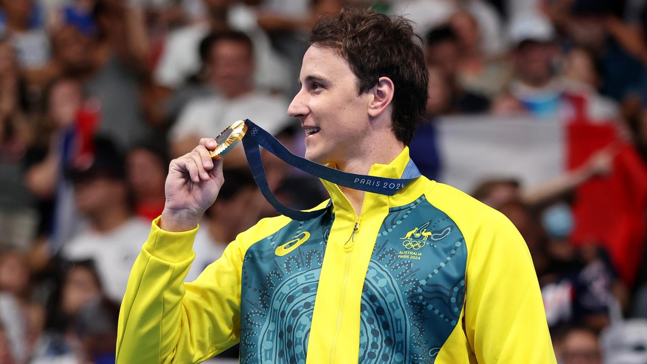 Gold Medallist Cameron McEvoy of Team Australia celebrated on the podium during the Swimming medal ceremony after the Men's 50m Freestyle Final. Picture: Sarah Stier/Getty Images