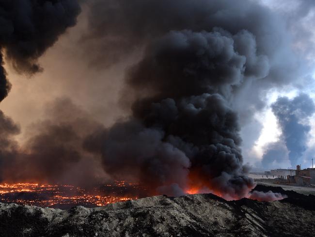 Retreating Islamic State fighters set alight an oilfield ahead of the Mosul offensive, which began eight months ago. Picture: Carl Court/Getty Images